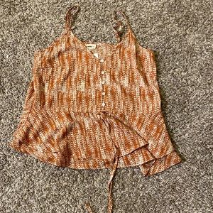 What and orange tank top